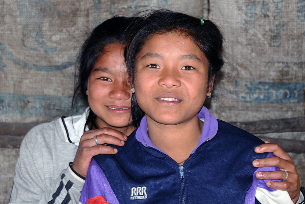 Laos girls as vendors at an intersection to Luang Prabang