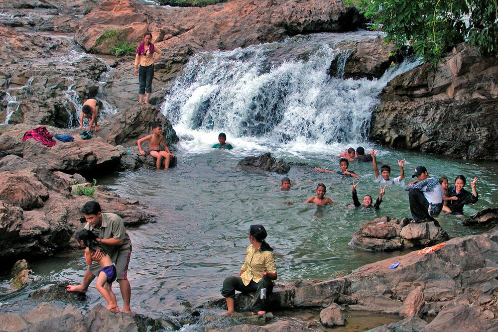 Laos peple enjoy playing in the Khone fall pool