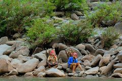 Laos women waiting for transport