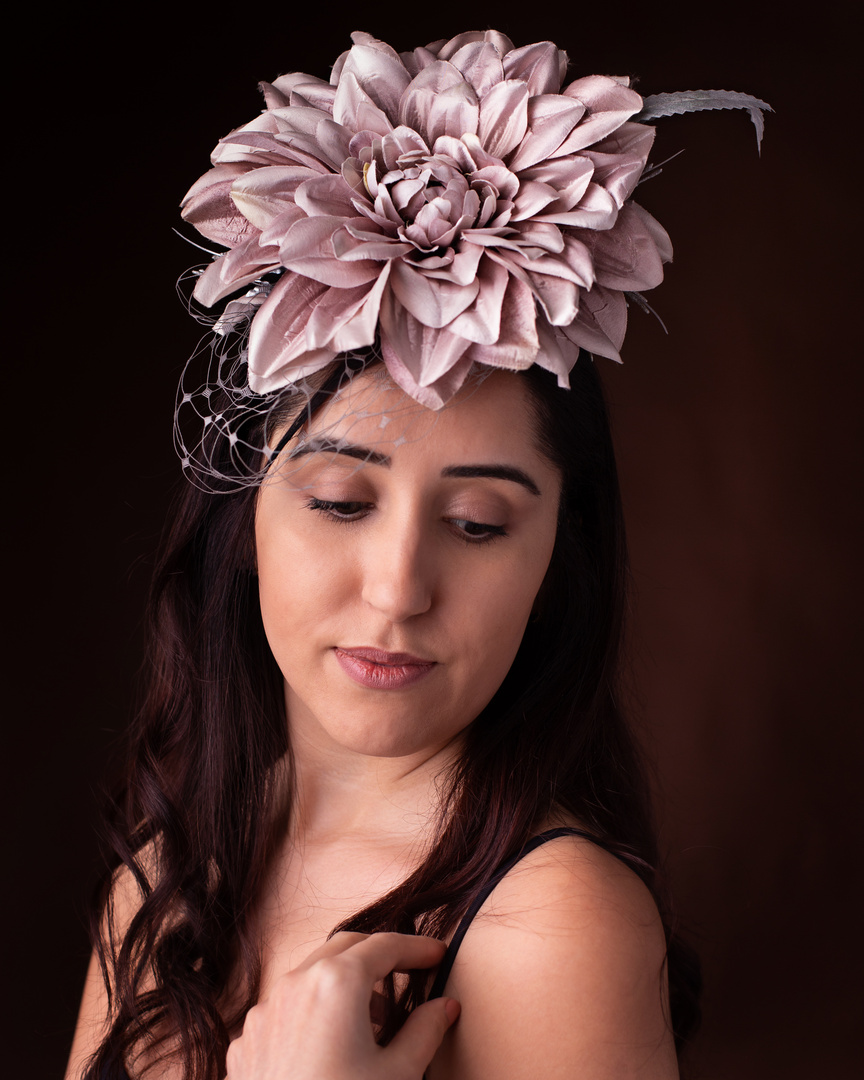 Large flower fascinator and a girl