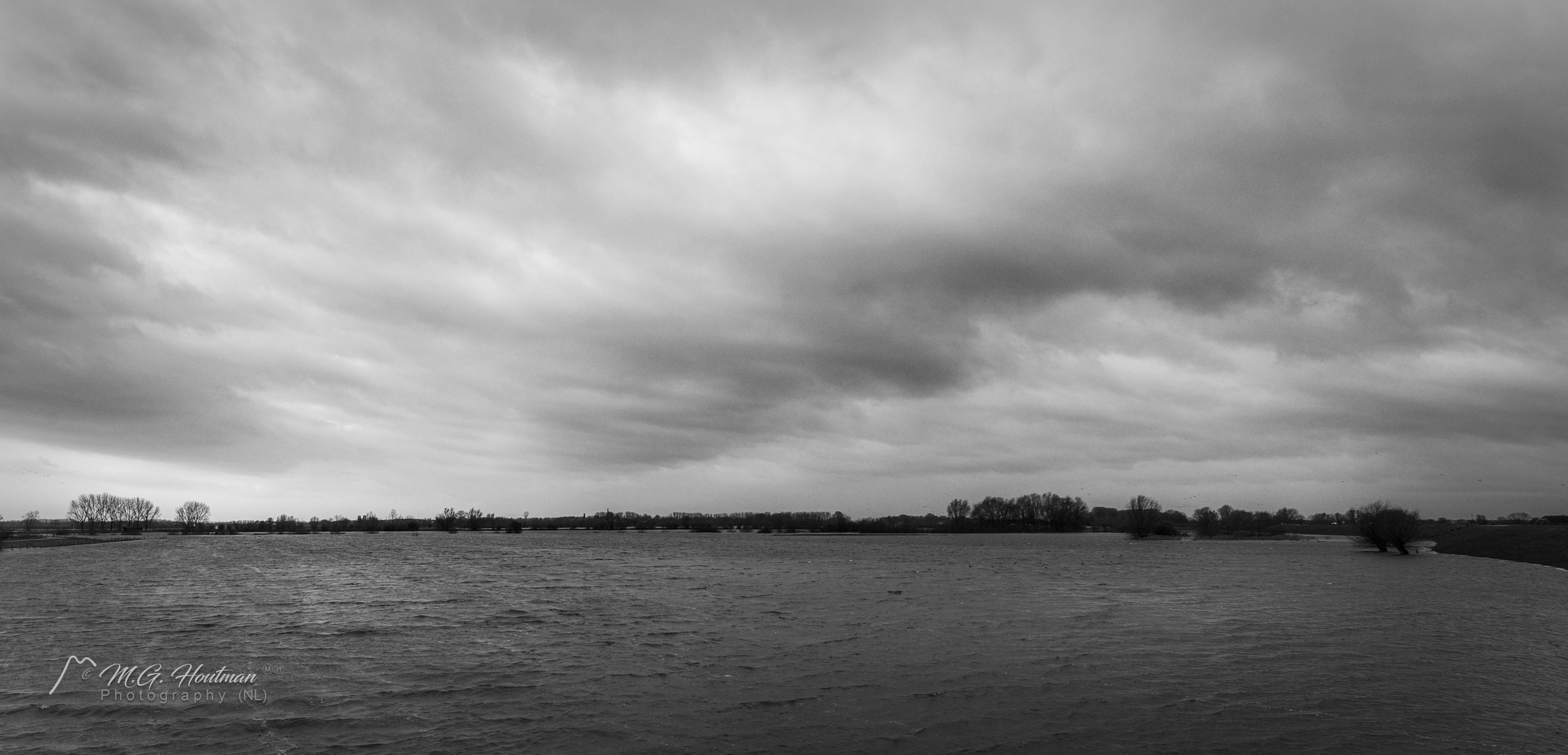 Large wide river Lek due to high tide (NL)