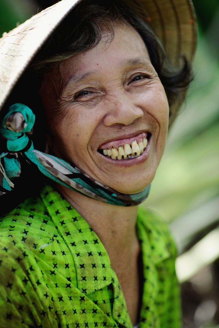 Laughing woman in the rice field.