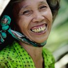 Laughing woman in the rice field.