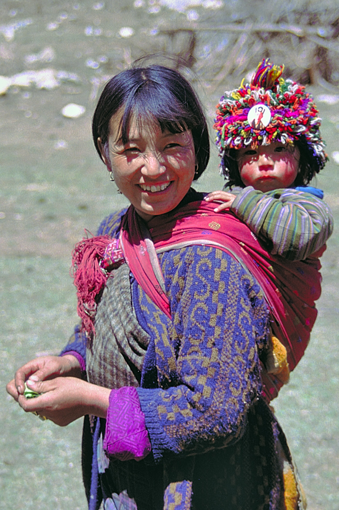 Laya mother and her son at her back