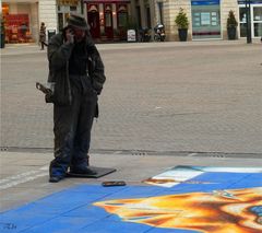 Le peintre des rues et son téléphone portable