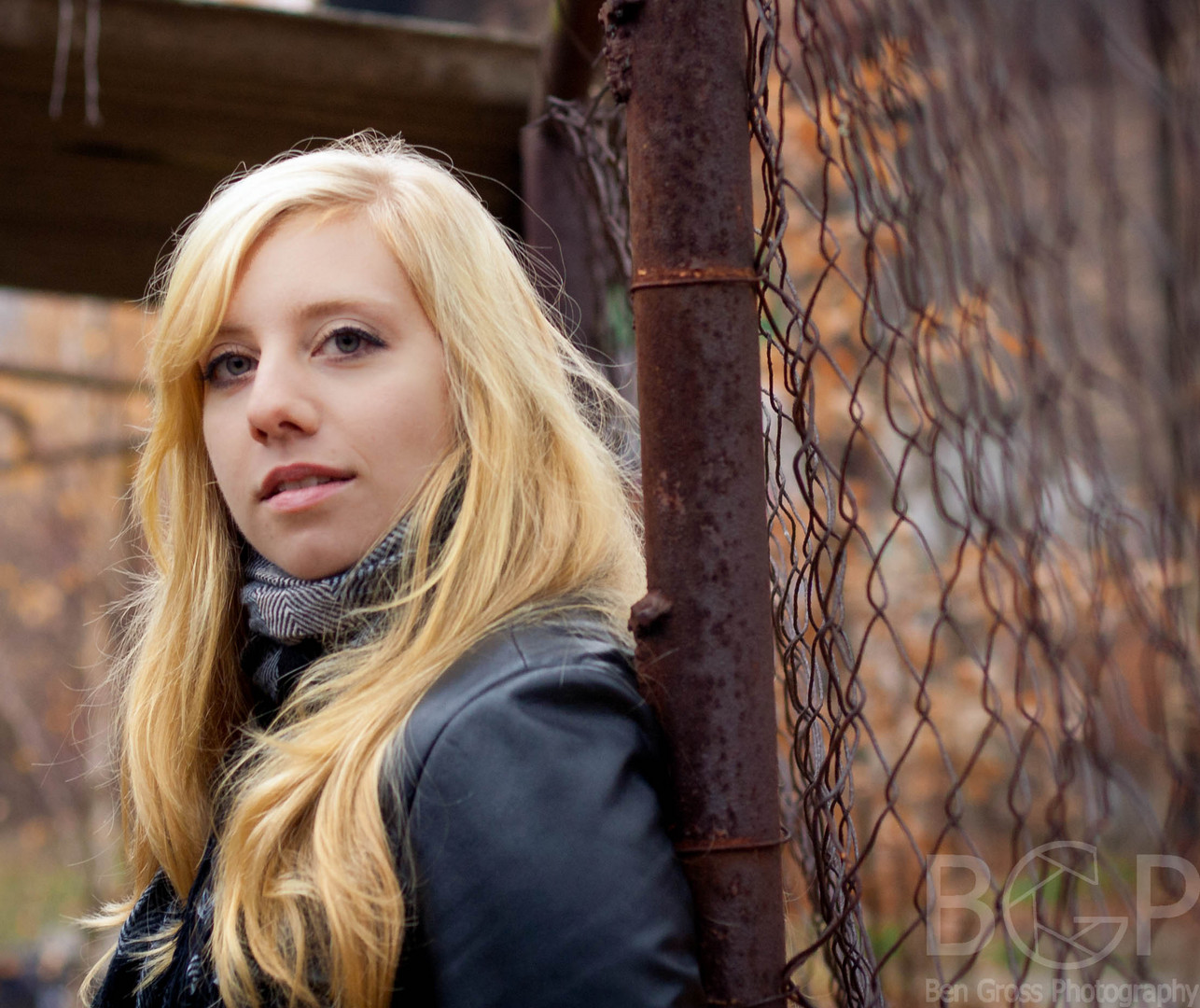 leaning on a fence