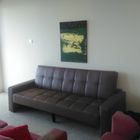 leather-faux couch and big canvas abstract with gold acrylics on green