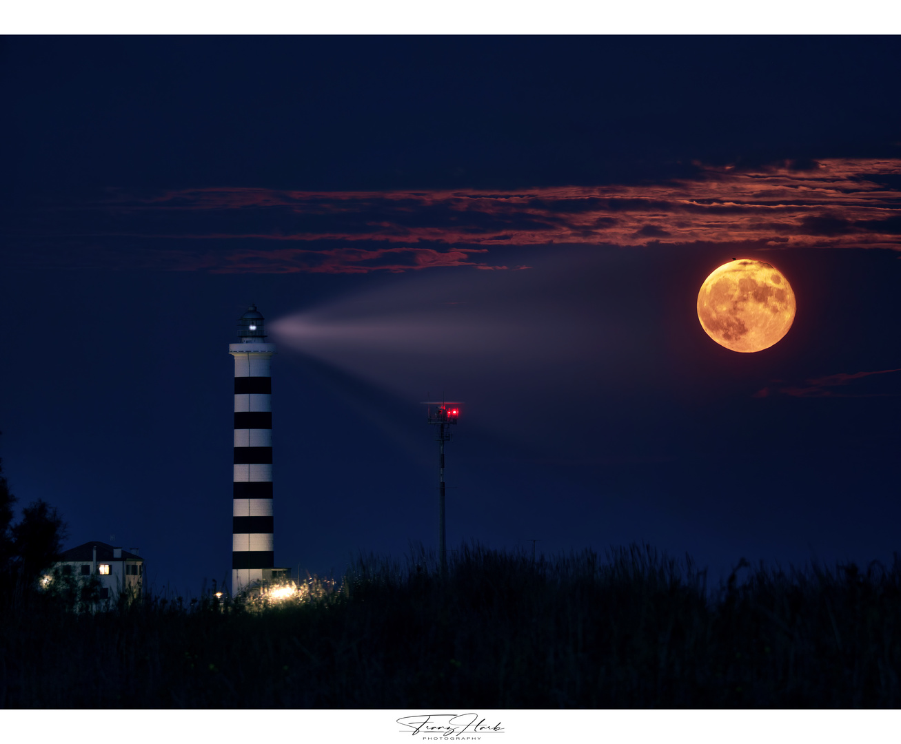 Leuchtturm bei Vollmond 