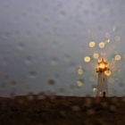 Leuchtturm in einer Regennacht