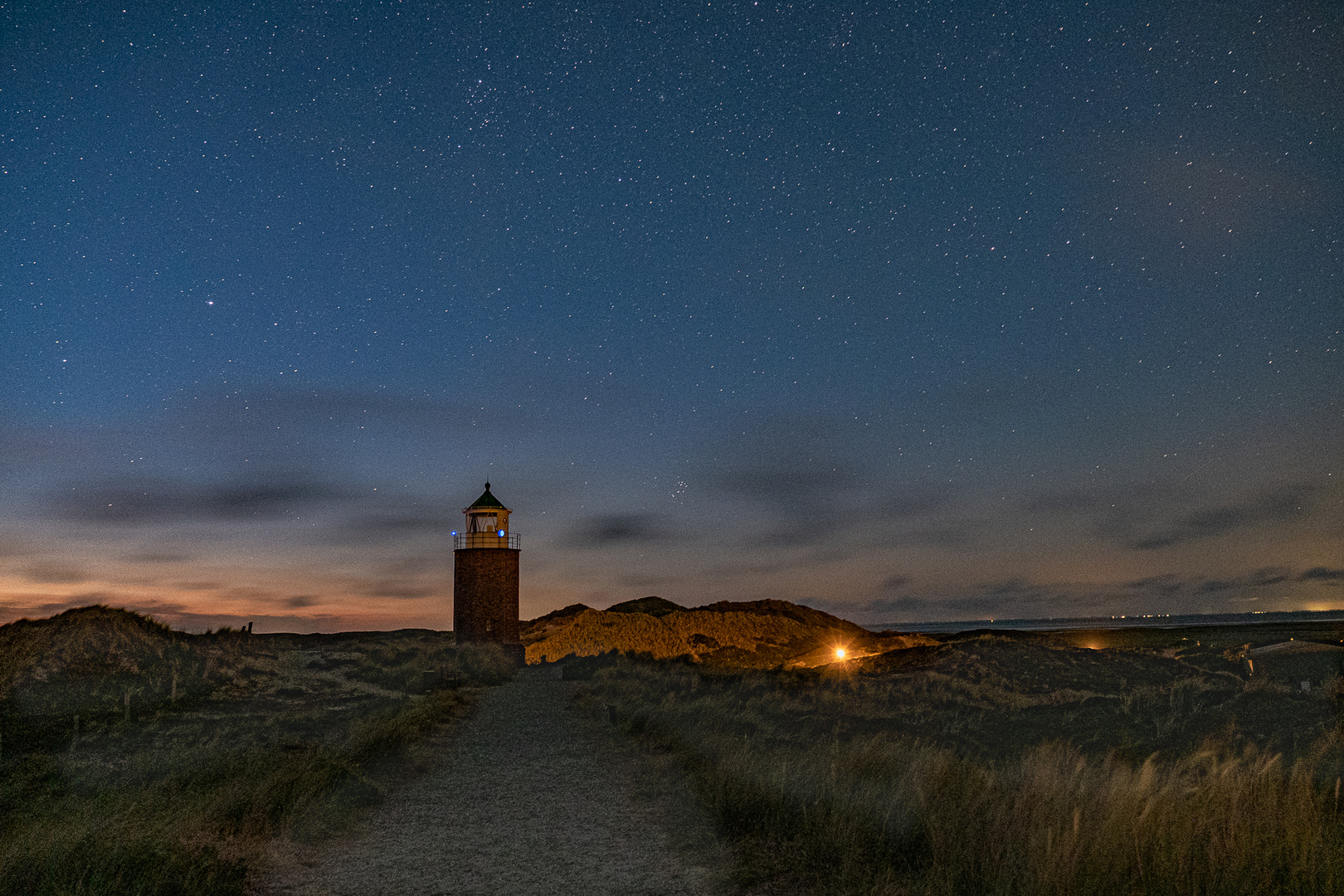 Leuchtturm mit Sternenhimmel