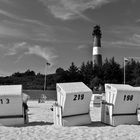 Leuchtturm und Strandkoerbe