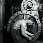 Lewis_Hine_Power_house_mechanic_working_on_steam_pump , 1920