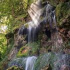 Lichtstrahlen am Uracher Wasserfall.