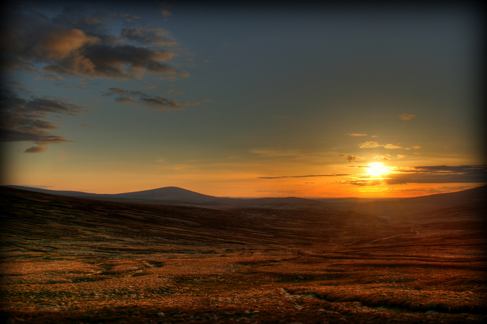 Light Disappearing Over Barren Land