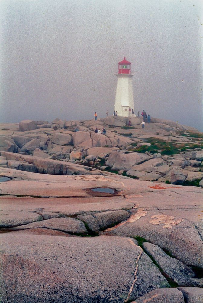 Light house in morning fog