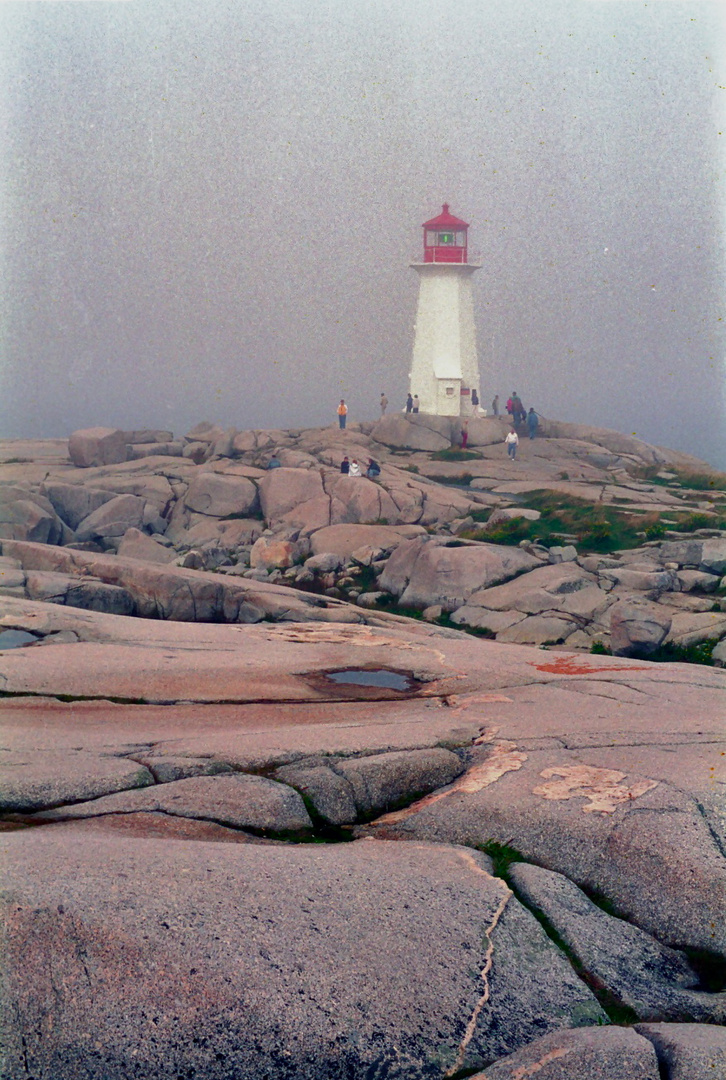 Light house in morning fog