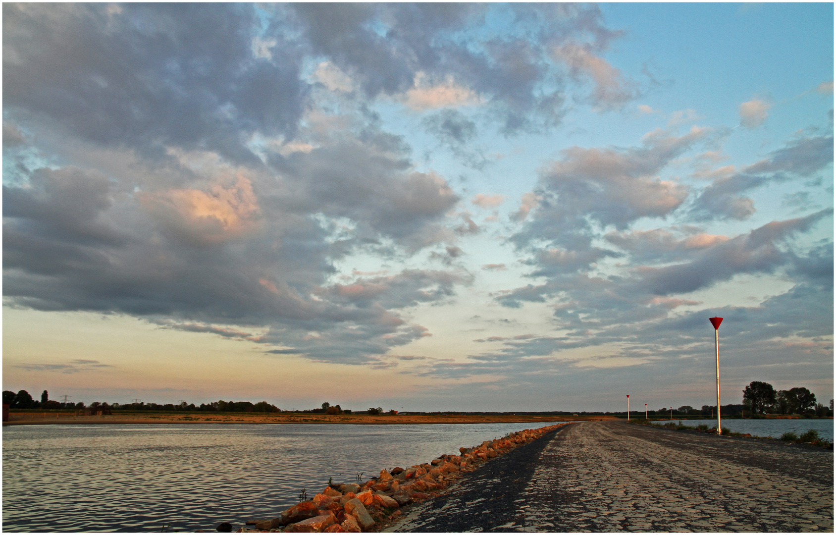 light of the coming sunset above the River Maas