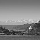 Lighthouse and Olympic Mountains