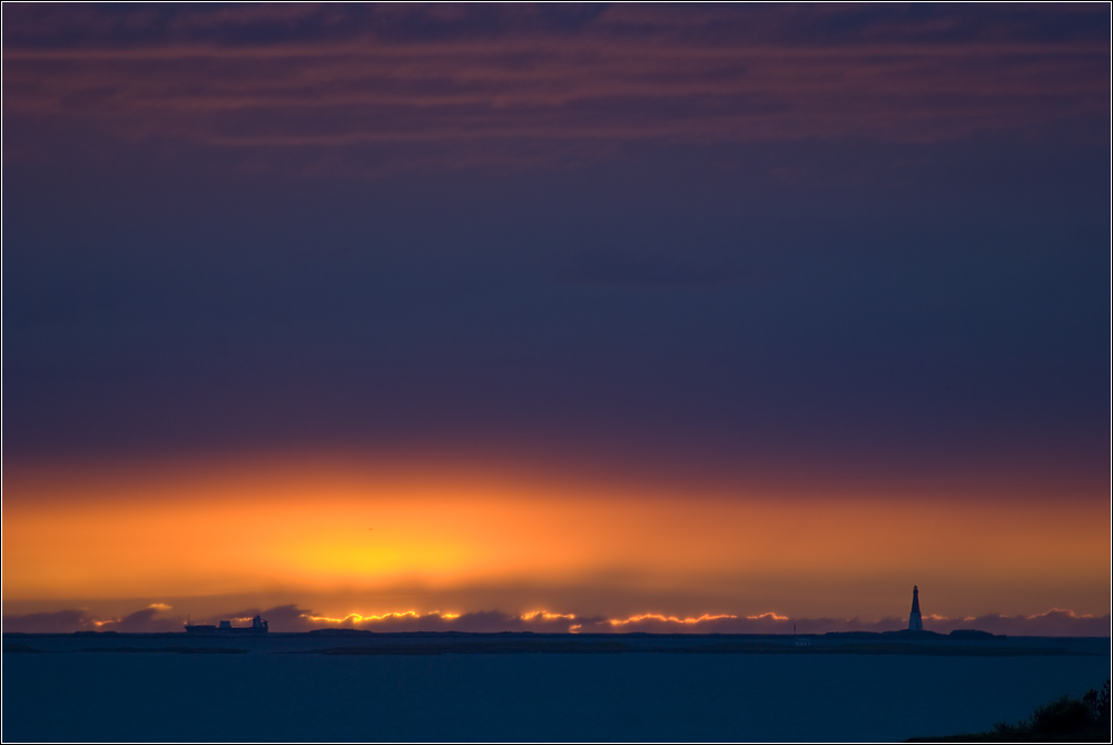 Lighthouse and ship