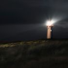 Lighthouse at night on Sylt island, at North sea,  on dunes