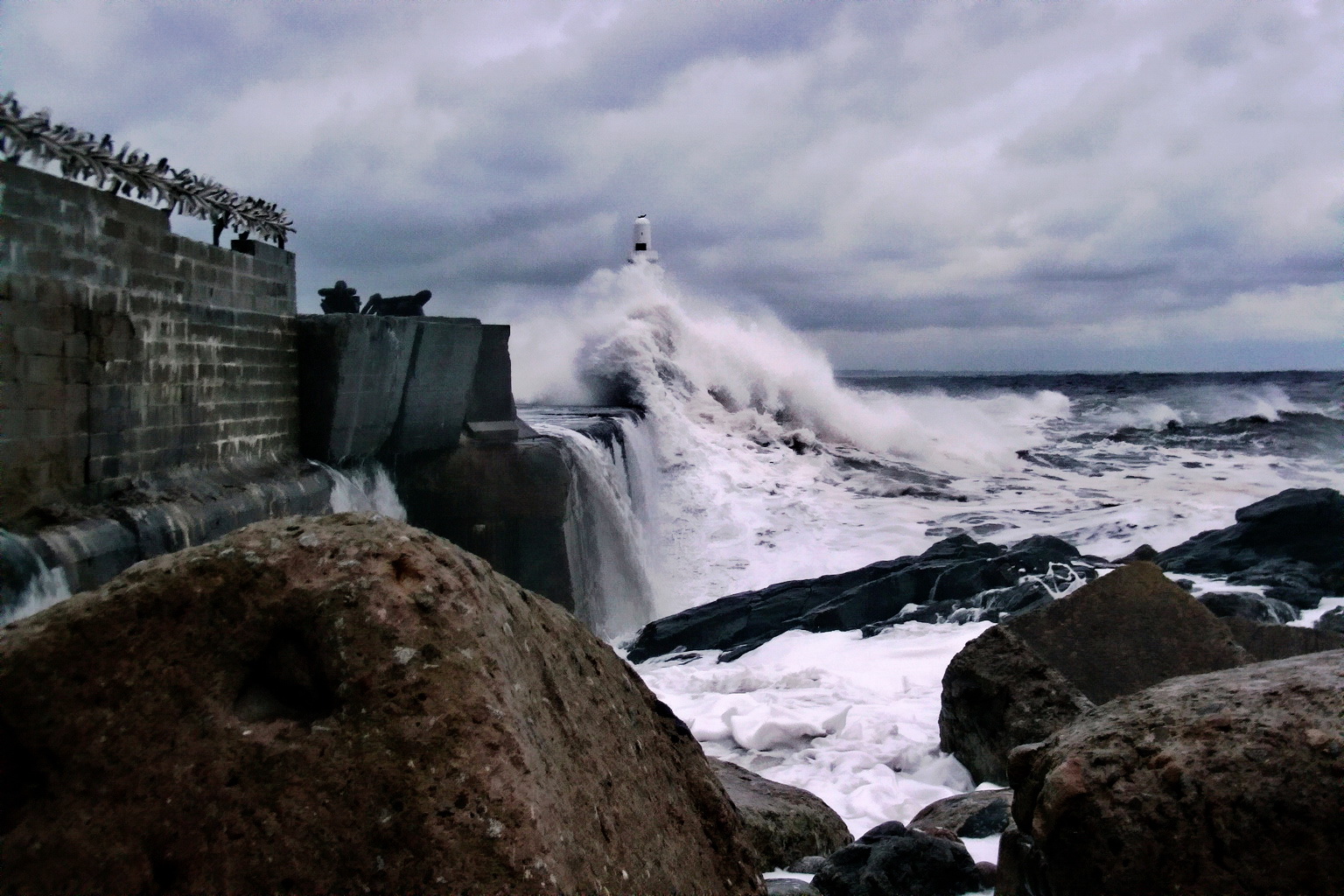 lighthouse in waves