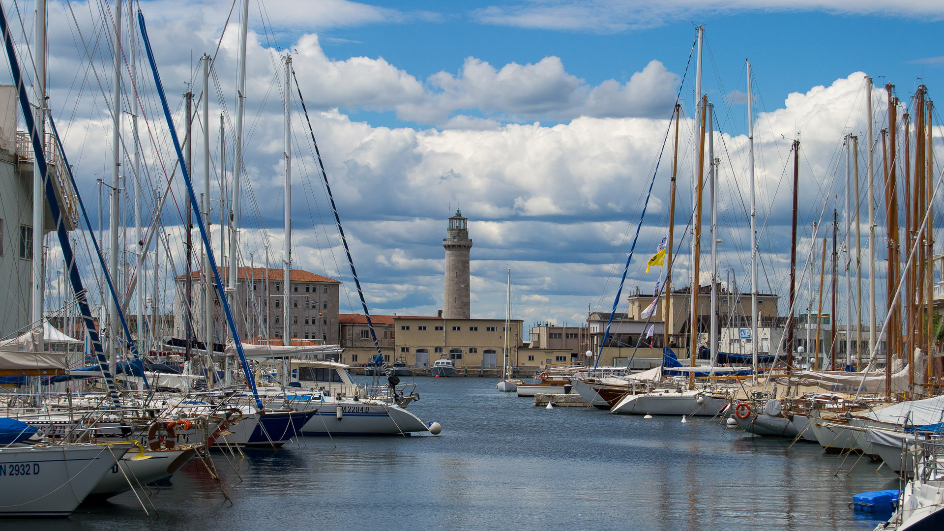 Lighthouse through marina