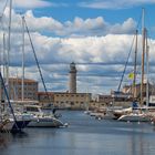 Lighthouse through marina