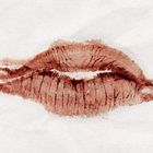Lippenstift auf Papier