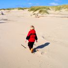 Little Boy walking on the beach