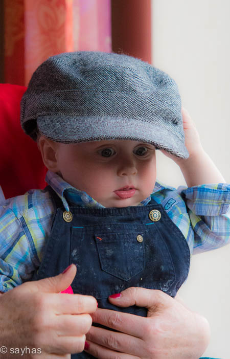 little boy with big cap