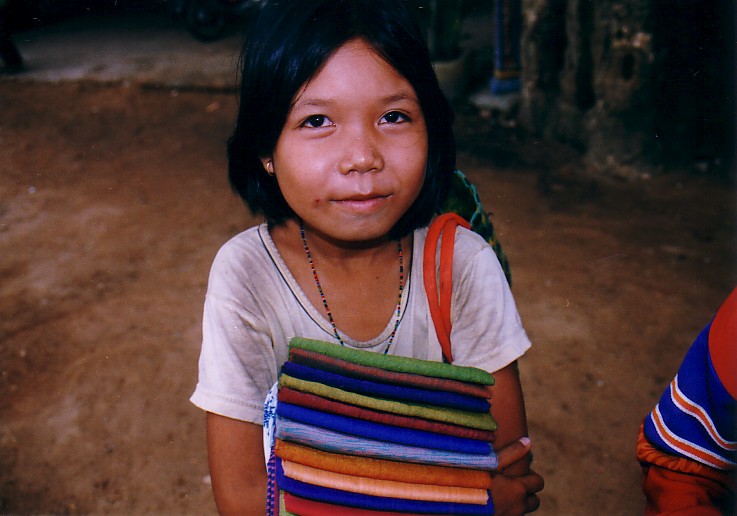 Little girl selling cambodian scarfs