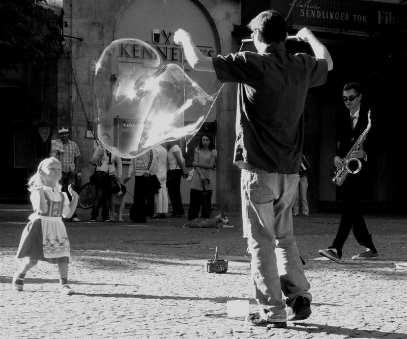 little girl with a bubble, bubble-maker and a sax player