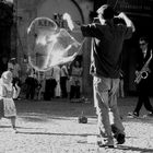 little girl with a bubble, bubble-maker and a sax player