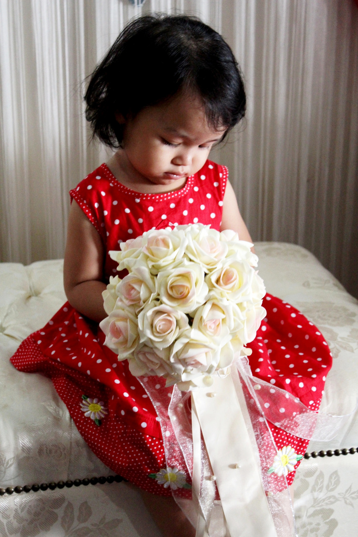 little girl with flowers