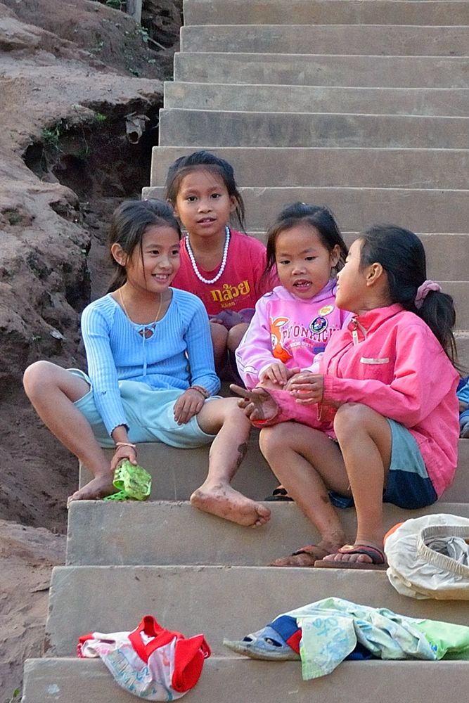 Little girls playing at the stairway