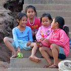 Little girls playing at the stairway