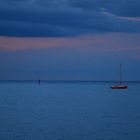 Little red boat in the sea