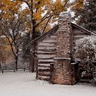 Log cabin in snow storm