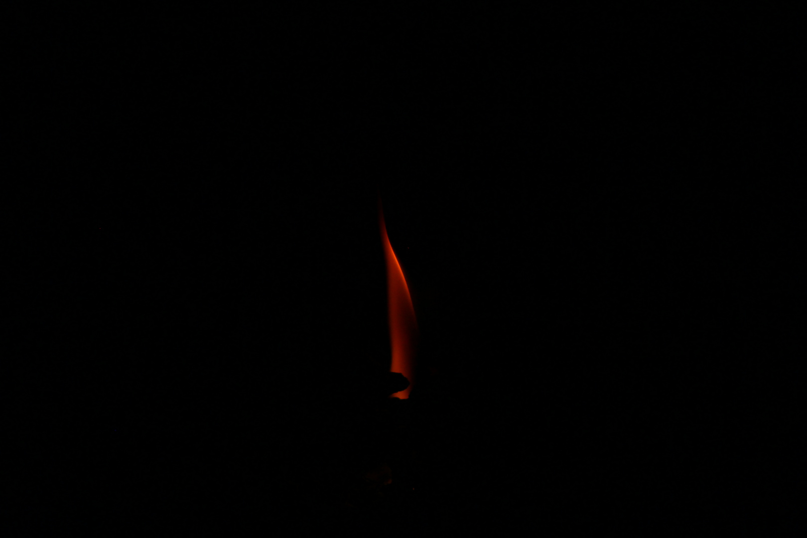 Lone flame in the fireplace