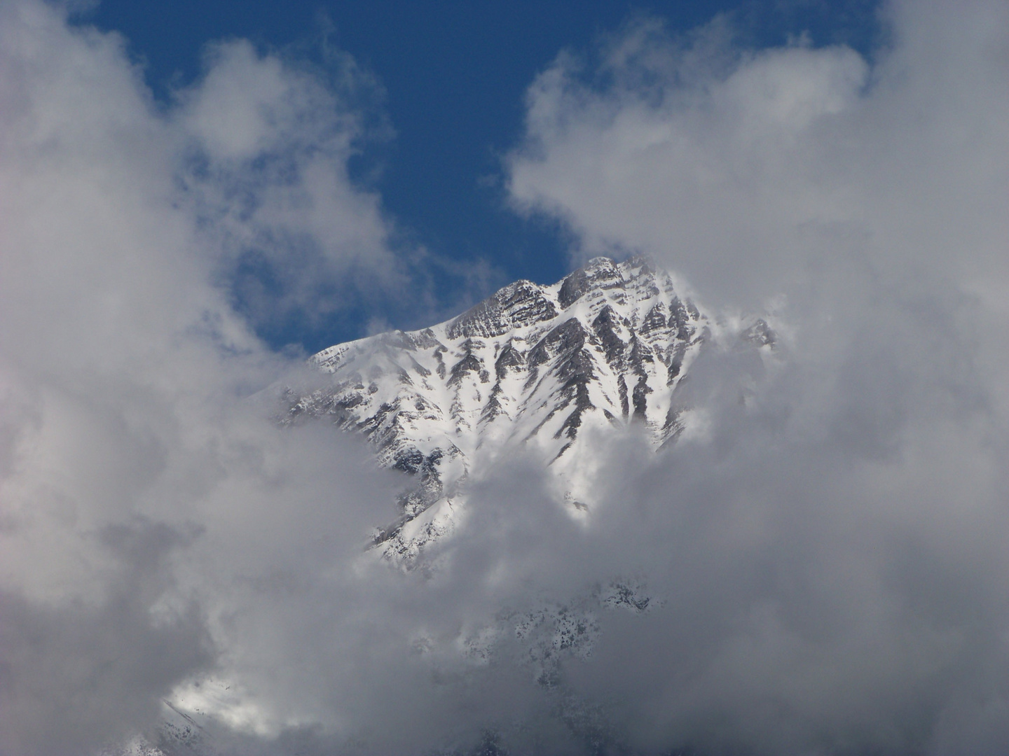 Lonely mountain surrounded by clouds