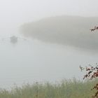 Lonely rower shrouded in fog