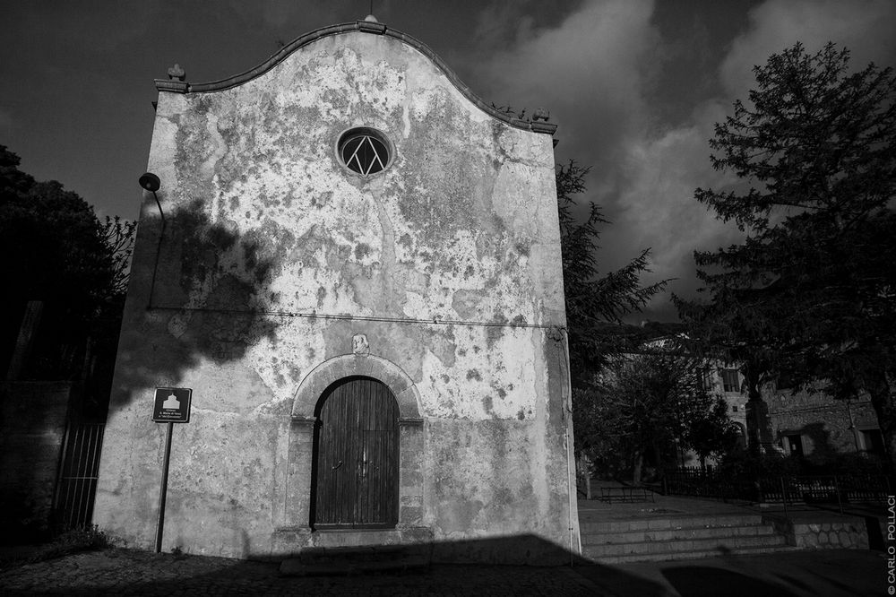 Long evening shadows on the small church