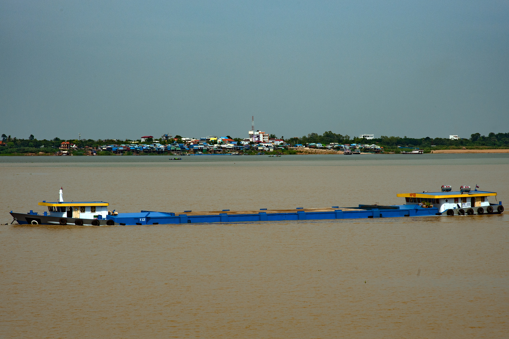 Long transporter vessel on Tonlé Sap