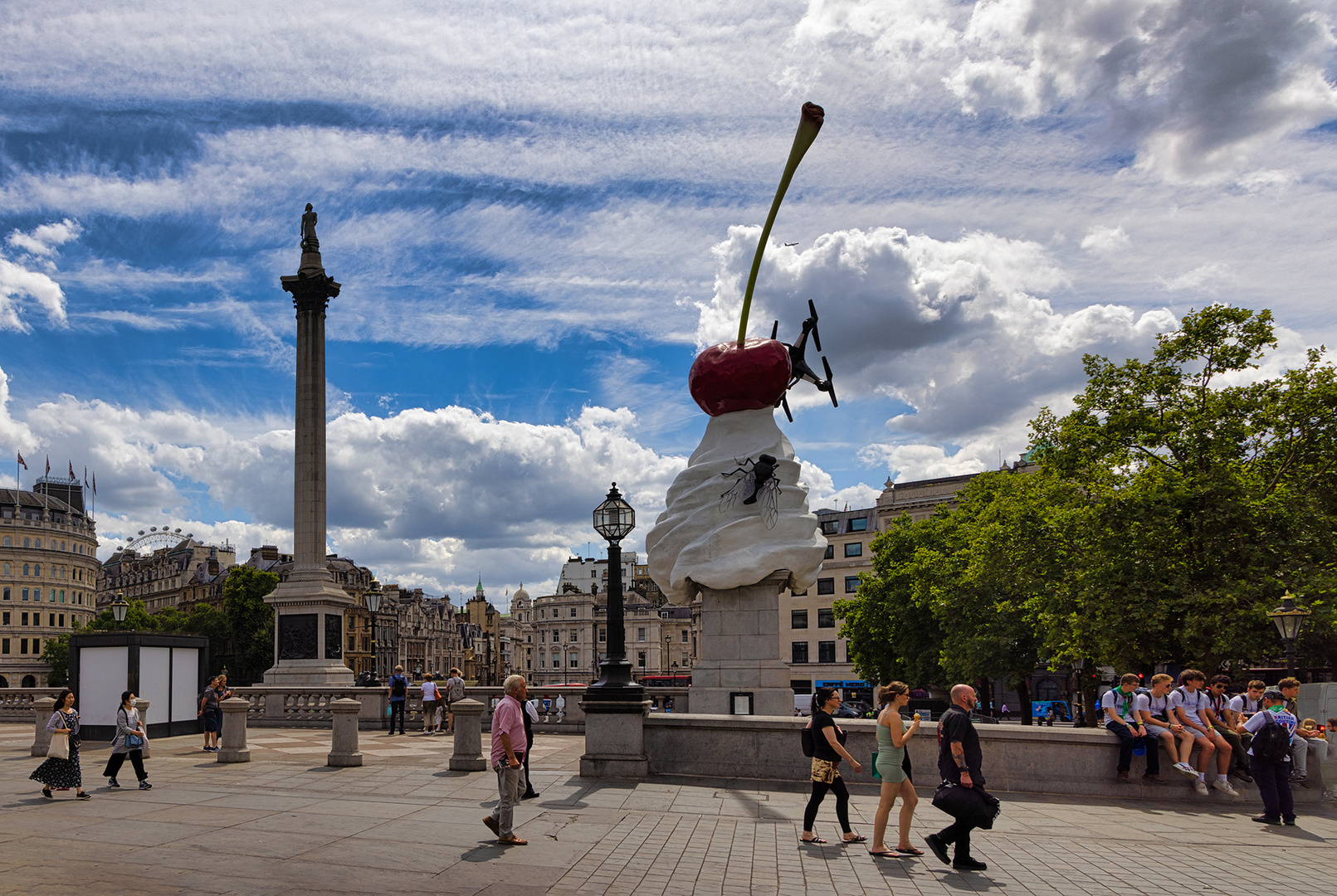 Lord Nelson, Cherry topped Creme, a small Plane, People passing People and some shredded Clouds