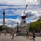 Lord Nelson, Cherry topped Creme, a small Plane, People passing People and some shredded Clouds