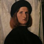 Lorenzo Lotto: Junger Mann vor weißem Vorhang
