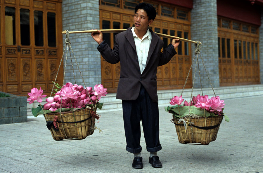 Lotusflower vendor in the streets of Kunming