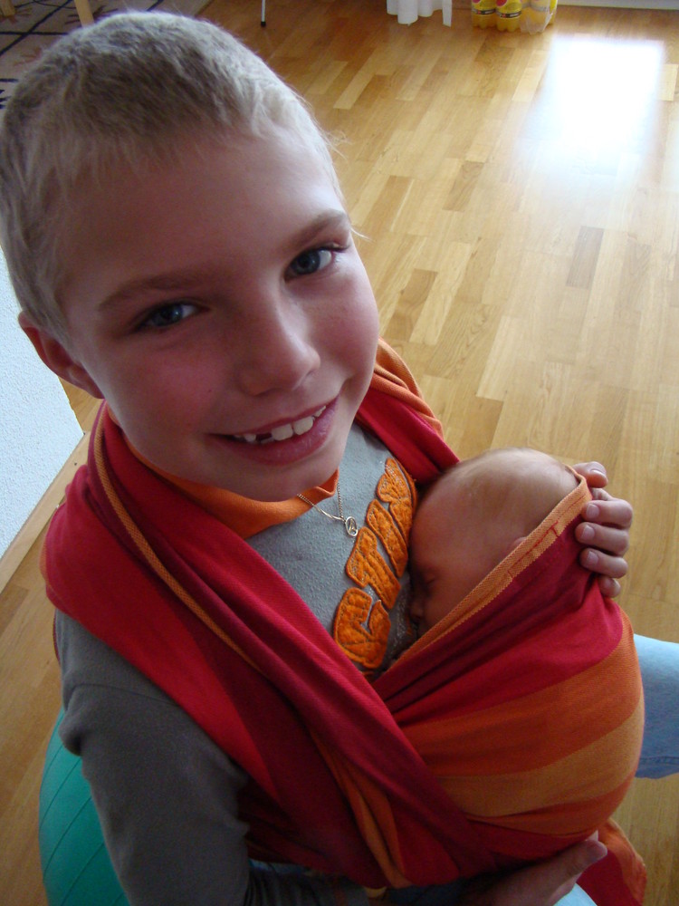 Luc holding Baby Tim