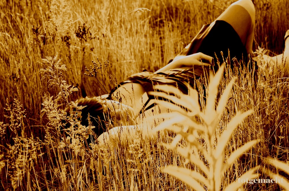 lying on the gras