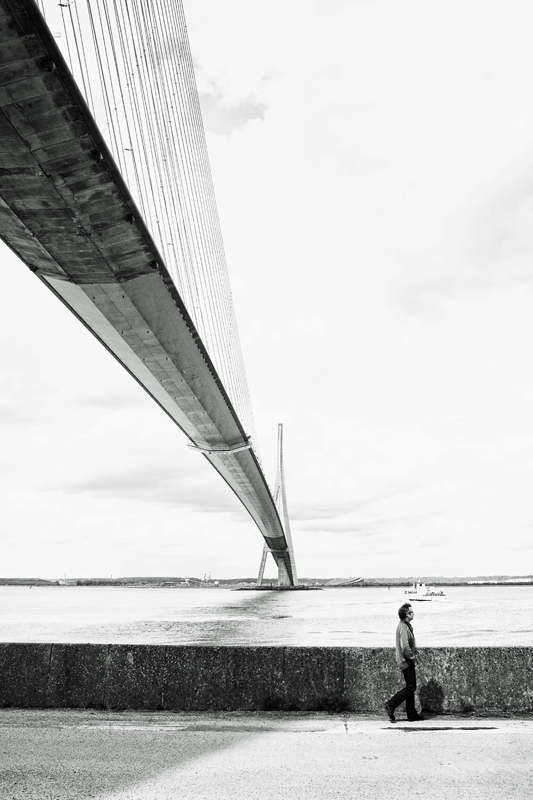 man-boat-bridge